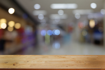 Empty dark wooden table in front of abstract blurred bokeh background of restaurant . can be used for display or montage your products.Mock up for space.
