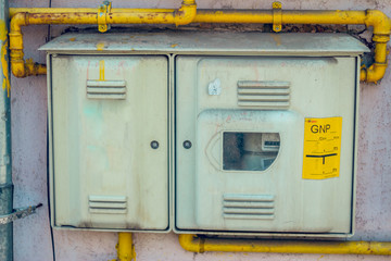 Measurement device of public facilities placed on the exterior of a house – Metal box with a control panel of gas flow – Special industry equipment for safety distribution