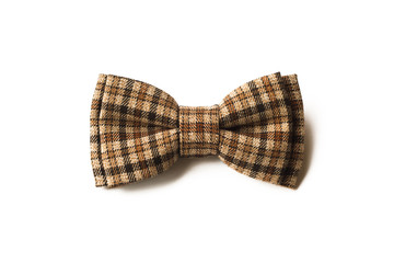 Brown checkered bow tie on a white background. Men's and women's accessories. Hipster style