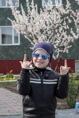 Happy children with colored glasses. Apricot flowering.