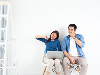 Asian Man and Woman talking boring and sleepy with laptop computer for business on white background