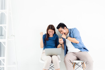 Asian Man and Woman talking with laptop computer for business on white background