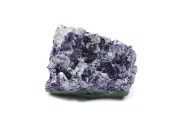 Natural Druse of purple amethyst crystal on a white background. Isolated