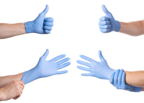 Doctor putting on sterile gloves isolated on white