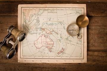 Binoculars and Compass on 1870 Map of Australia – World Travel