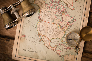 Binoculars and Compass on 1870 Map of North America – World Travel