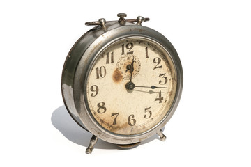 Old alarm clock isolated on white background