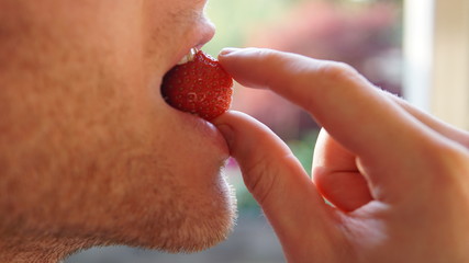 Man eating strawberry - 264264985