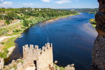 VIEW OVER THE CASTLE WALL OF ALMOUROL WITH THE TAGUS RIVER IN THE BACKGROUND, PORTUGAL