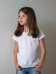 Fototapeta premium Cute little girl in white t-shirt