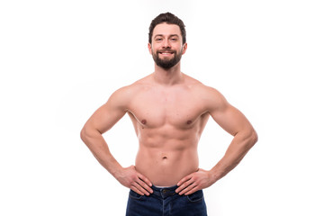 Portrait of a well built shirtless muscular man against on white background
