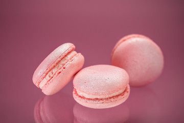 Pink macaroons on a beautiful pink background.
