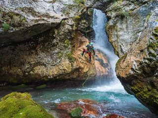 Abseiling over waterfall © Ziga