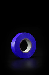 Colored electrical tape on a black background isolate.