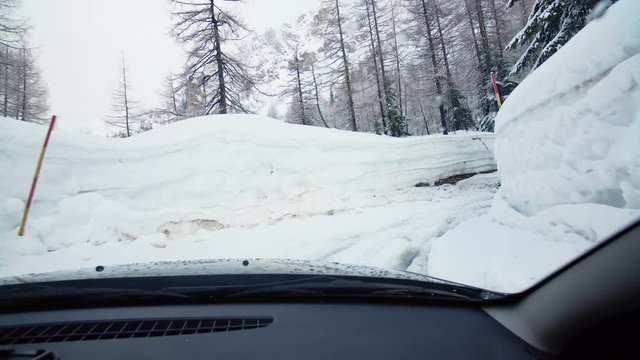 Passenger seat view driving an suv trugh deep snow