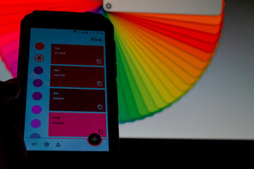 Electronic color palettes between a smartphone and a laptop.