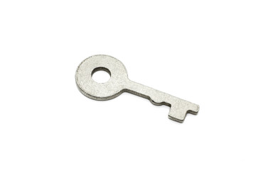 Simple metallic key on white background