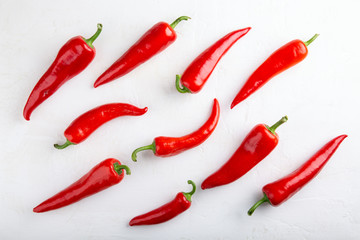 Red pepper pattern on white background. Top view,  flat lay, close-up. Ramiro pepper. Food concept.