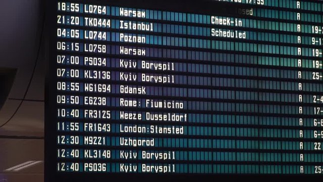 Departures board at the airport. Flight information electronically timetable