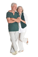 Portrait of happy senior couple embracing isolated