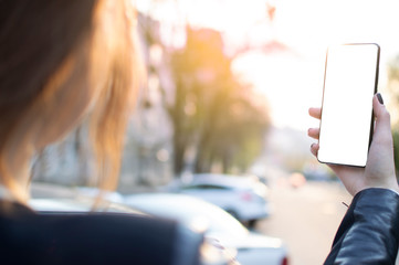 the girl is holding a frameless smartphone, and his screen is lit up creating free space