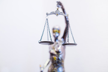 Statuette of Justice - Themis, ancient Greek goddess of divine law & justice, described as lady of wisdom and good counsel, wears blindfold, holds a sword and raises a balance scale of justice