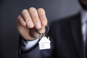 man hand house key