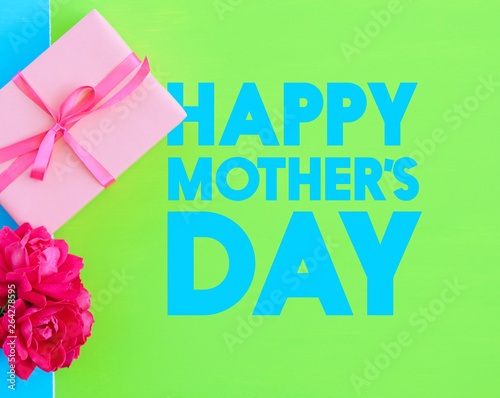 Happy Mother's Day gift on bright green background.  Text for card or graphic, holiday concept.