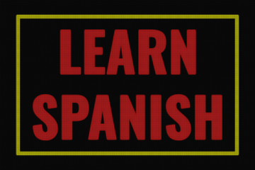 Learn Spanish word on dark screen