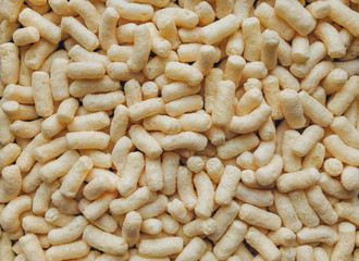 Background of yellow corn sticks. The view from the top. Dietary breakfast concept.