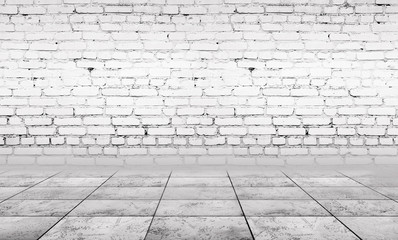 Background of empty gray room with brick wall and concrete floor.