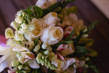 wedding bouquet on wooden table, rustic bouquet for bride.