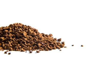 Instant coffee granules isolated on a white background, macro closeup.