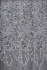 The texture of lace on wooden background