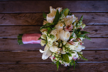 wedding bouquet on wooden table, rustic bouquet for bride.