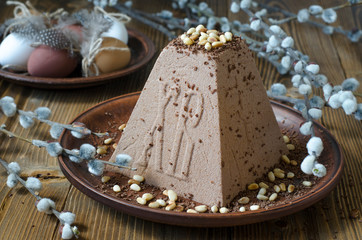 Easter cake with eggs and a bouquet of flowers