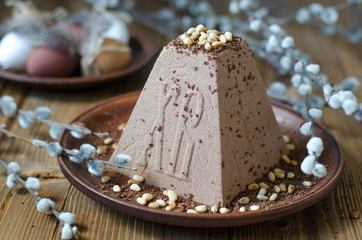 Easter cake with eggs and a bouquet of flowers