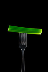 Celery on Fork with black background