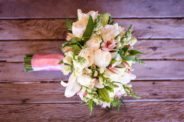 wedding bouquet on wooden table, rustic bouquet for bride.