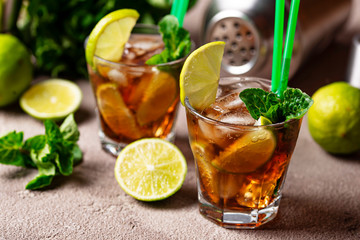Cuba libre cocktail with mint and lime