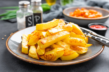Baked, fried potato on plate