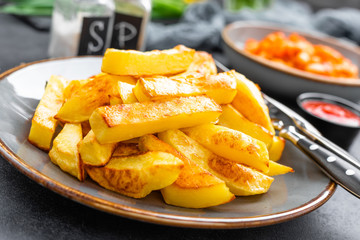 Baked, fried potato on plate