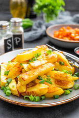Baked, fried potato on plate