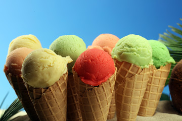 Set of ice cream scoops of different colors and flavours with berries and fruits