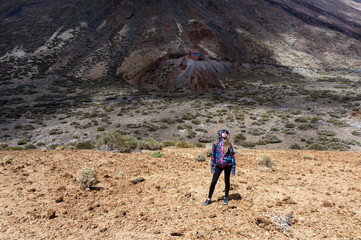 Girl stand among  volcano nature park