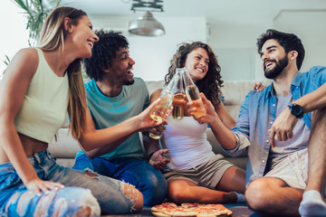 Group of young friends eating pizza.Home party.