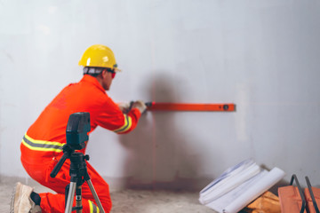 Men and working with laser level machines