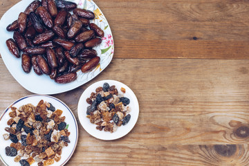 bowl of mixed dry fruits and nuts on wooden table