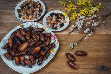 bowl of mixed dry fruits and nuts on wooden table