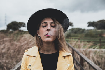 Girl with black hat and yellow jacket